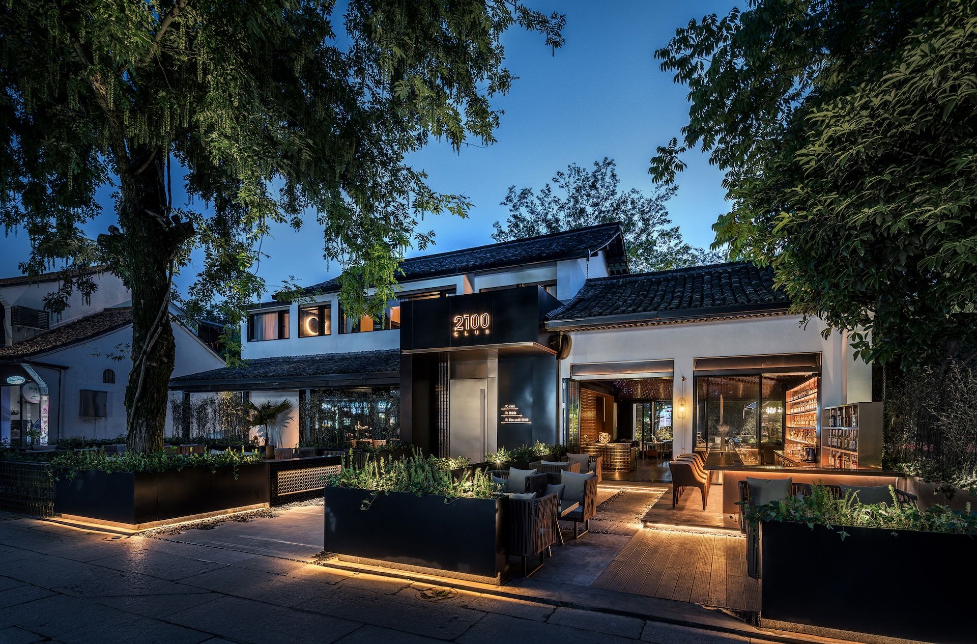 Commercial landscape lighting at dusk