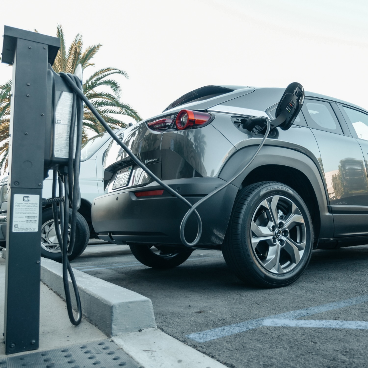 Electric vehicle charging at a commercial charging station